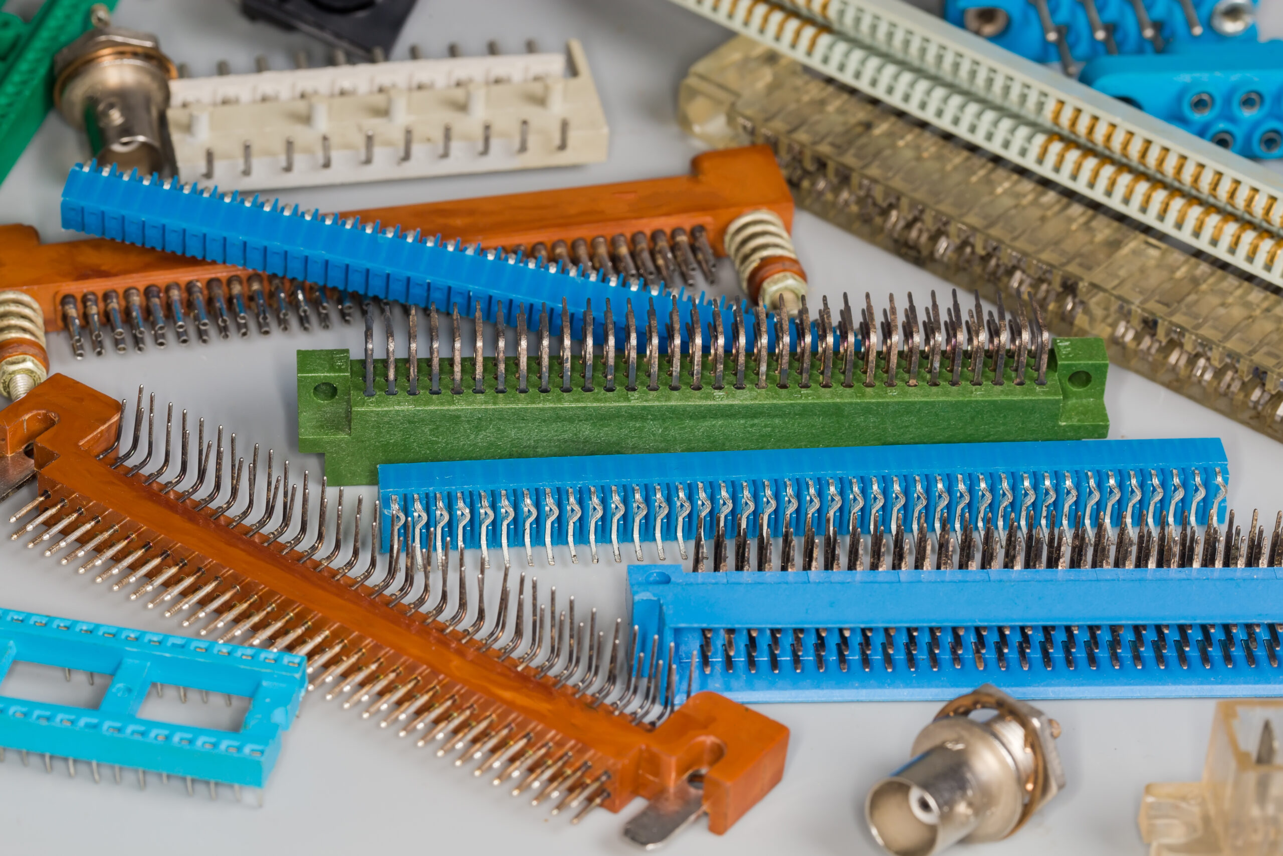 Heap of various electrical connectors for different purposes, selective focus